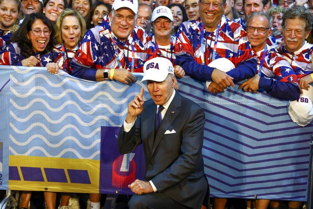 President Joe Biden poses for a picture with American athletes competing in the Maccabiah Games at Teddy Stadium in Jerusalem on July 14, 2022.