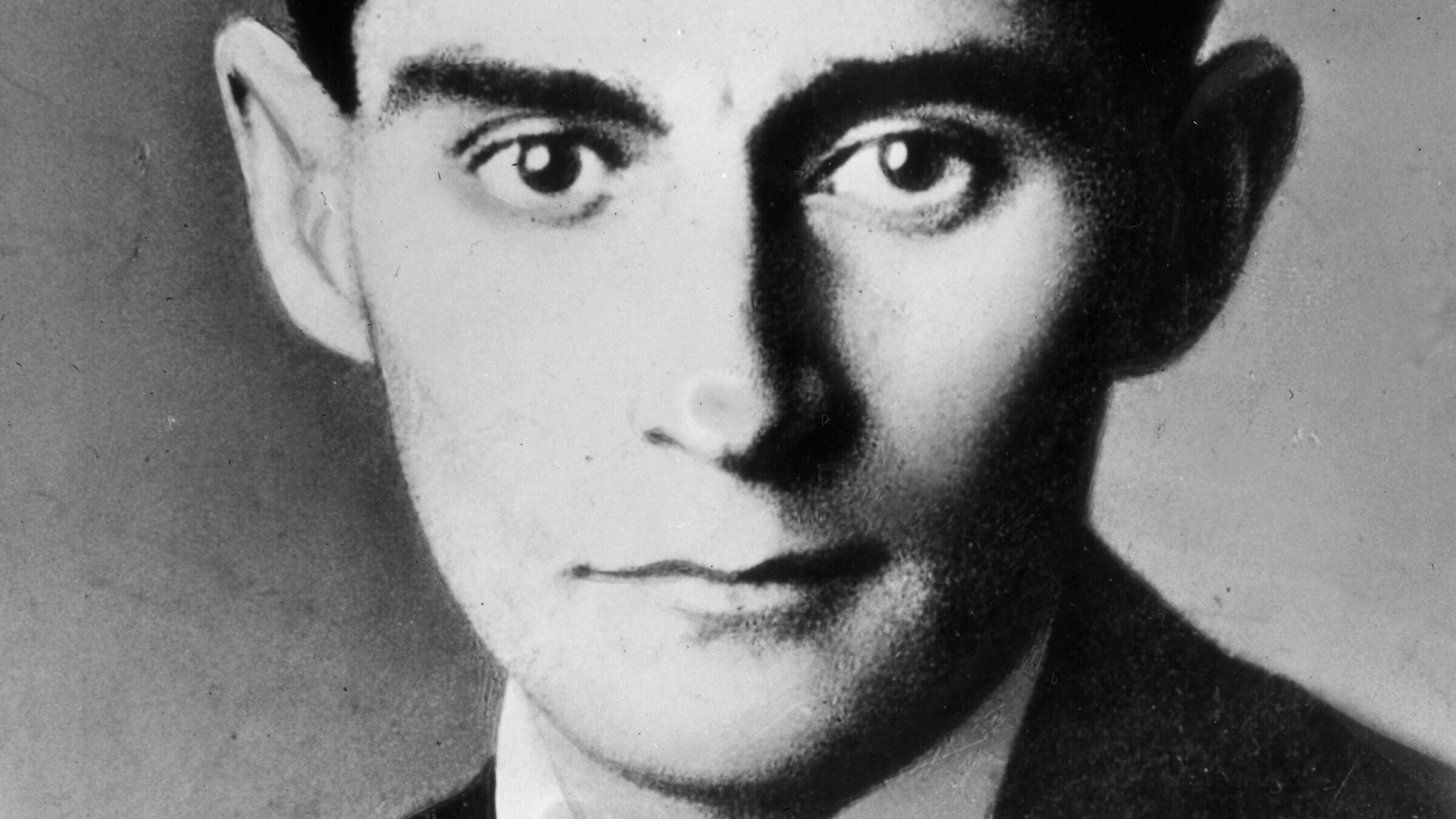 A portrait of Franz Kafka.