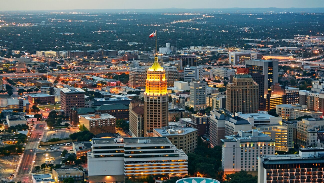 Aerial view of downtown San Antonio illuminated at dusk. (Getty Images)