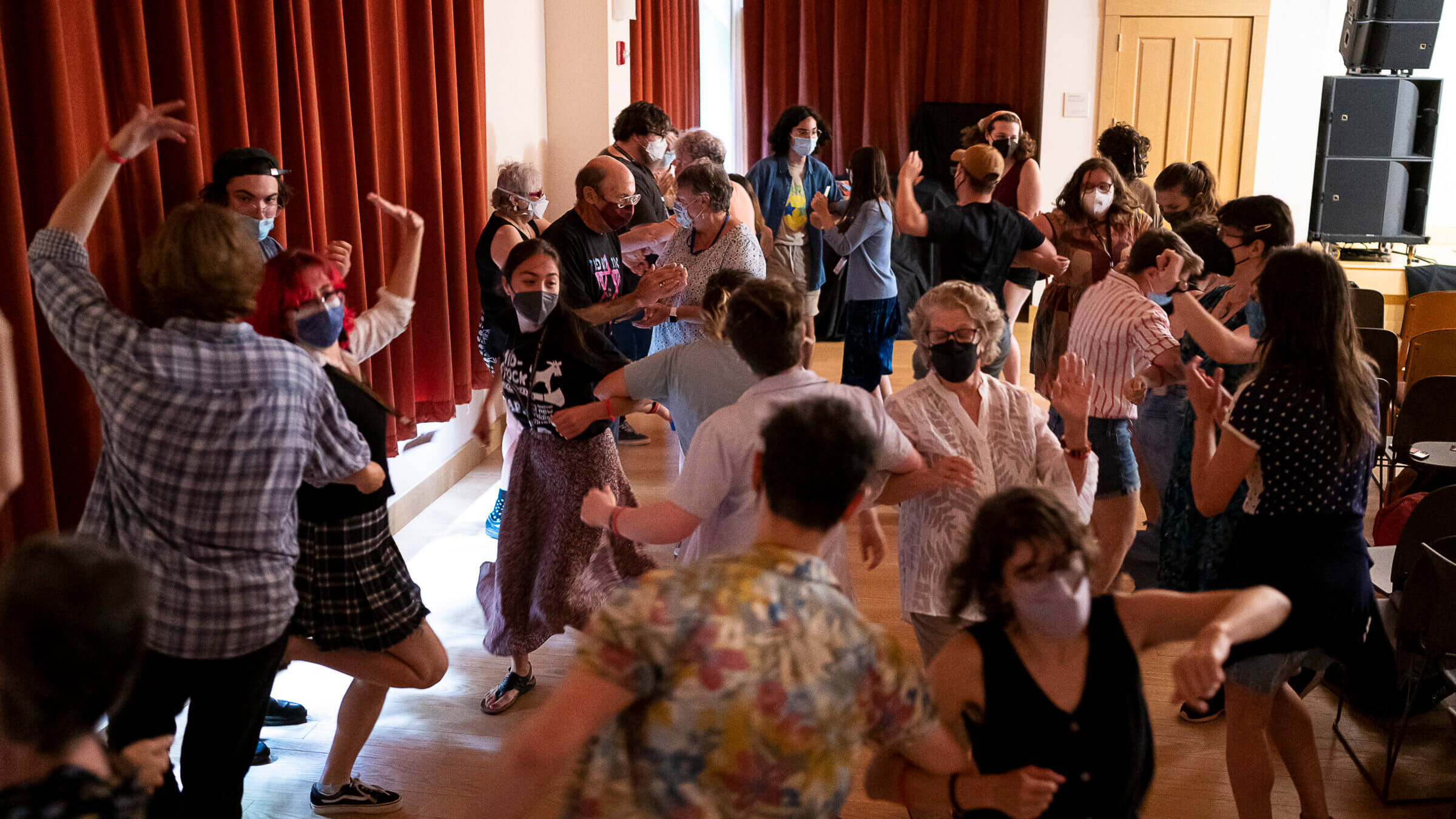 Audience members jump up to dance during a concert at Yidstock. 