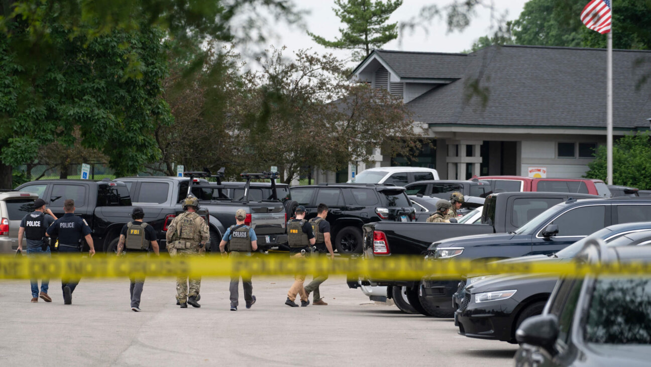 Law enforcement officers at the scene of a July 4 parade shooting in Highland Park, Illinois.