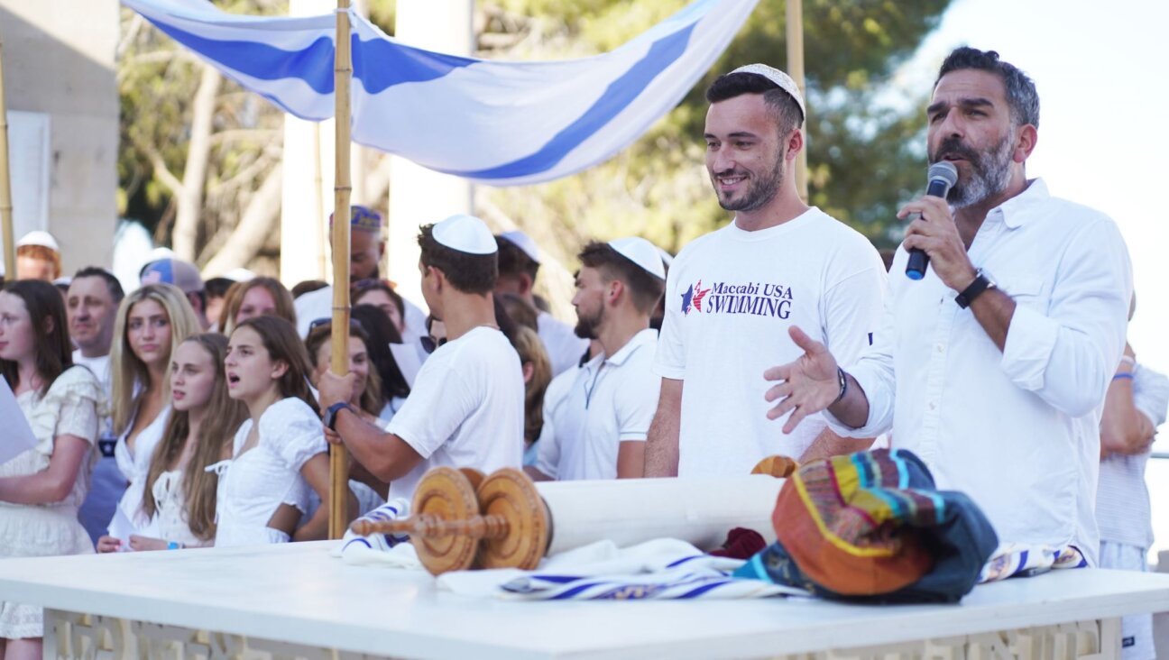 Joshua Fountain (second from right) and Rabbi Leor Sinai (right) at a bar and bat mitzvah ceremony for American Maccabiah athletes who never had one when they were younger, at the Mt. Scopus campus of The Hebrew University in Jerusalem, July 11, 2022