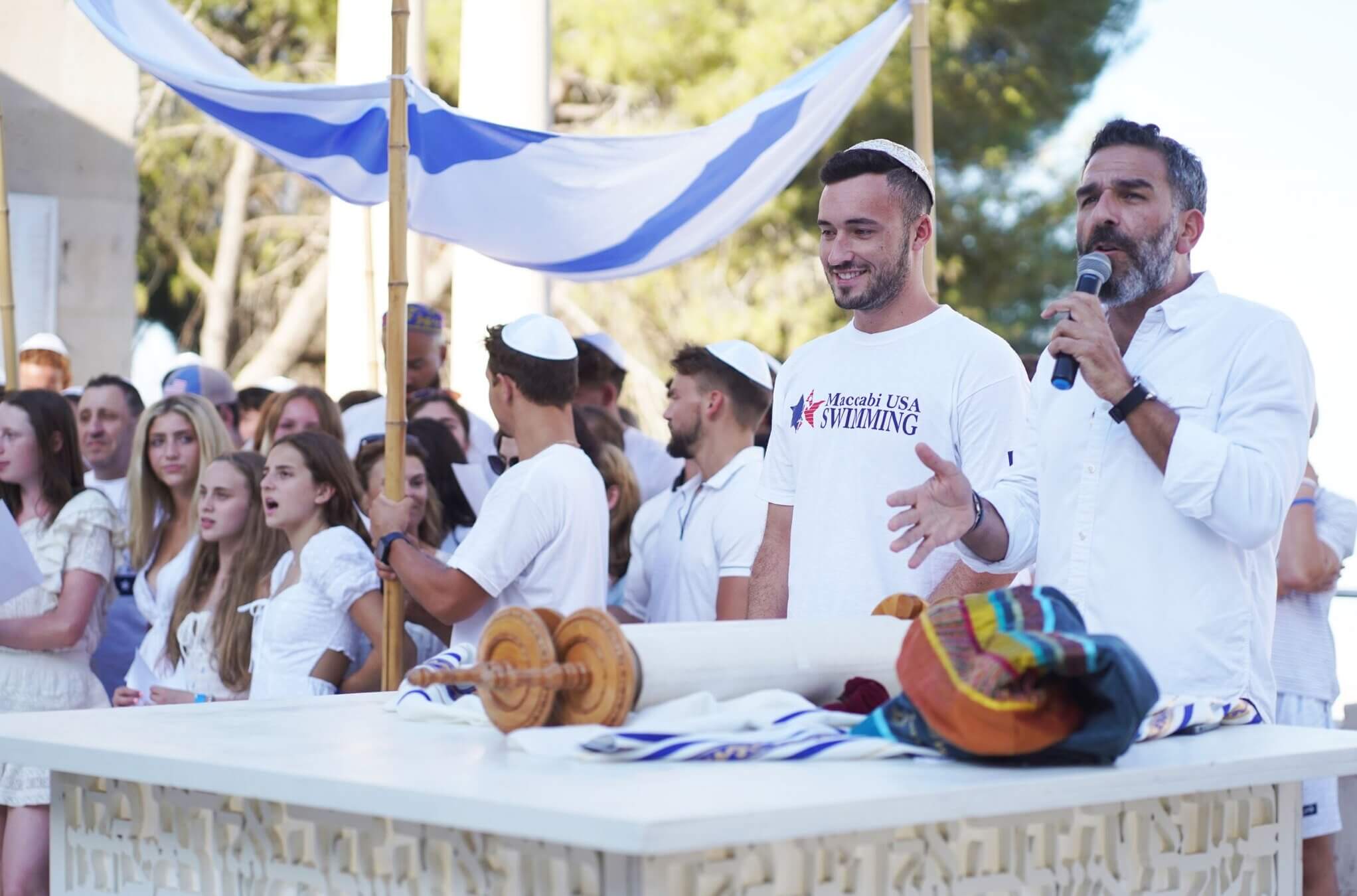 Joshua Fountain (second from right) and Rabbi Leor Sinai (right) at a bar and bat mitzvah ceremony for American Maccabiah athletes who never had one when they were younger, at the Mt. Scopus campus of The Hebrew University in Jerusalem, July 11, 2022