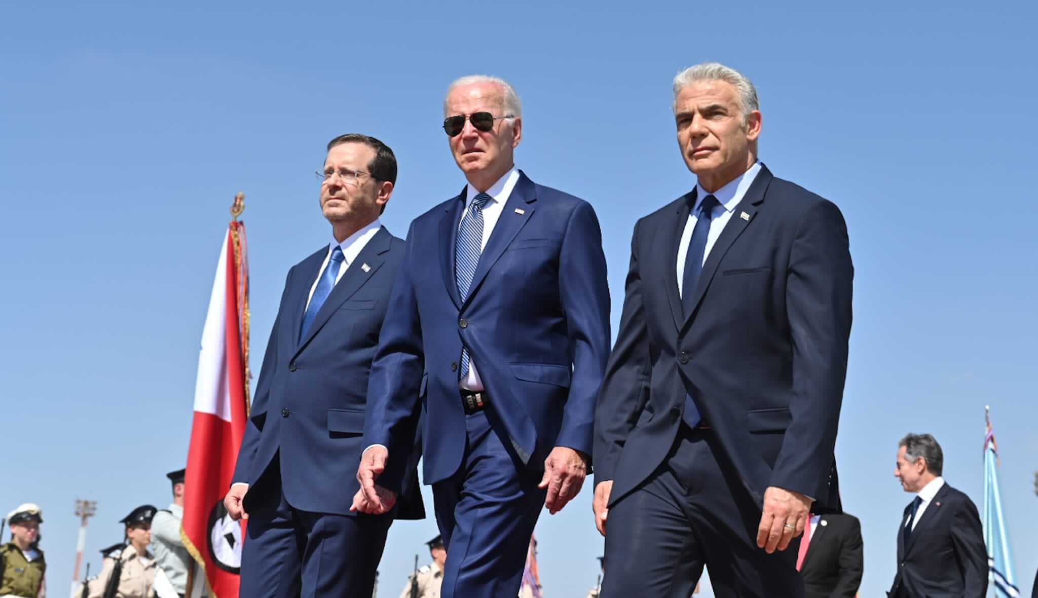 President Joe Biden welcomed by Israeli President Isaac Herzog and Prime Minister Yair Lapid at Ben Gurion International Airport in Tel Aviv on July 13, 2022.