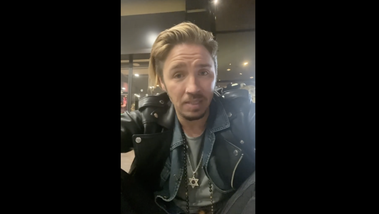 Gil Ofarim, a German-Israeli singer, said in a video posted to social media that he had been denied a hotel room in Leipzig, Germany, after being told to hide his Jewish star necklace. (Screenshot from Instagram video)