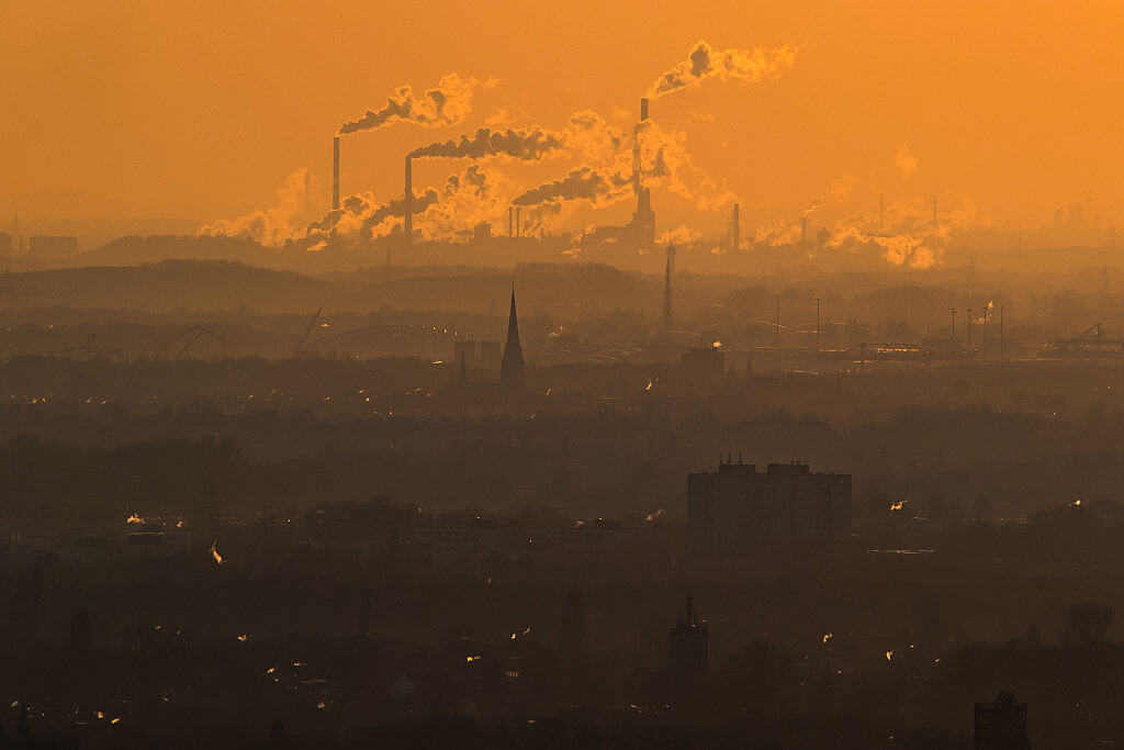 Steam and exhaust rise from different companies on a cold winter day in 2017 in Oberhausen, Germany.