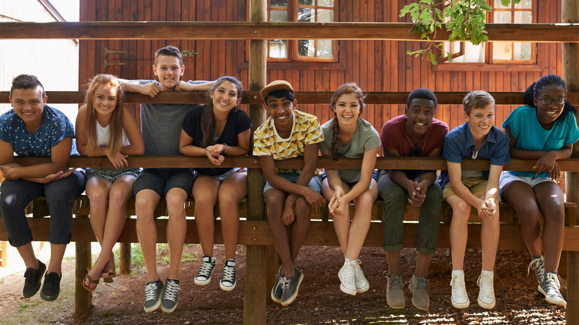 A group of nine campers smiling for a photo
