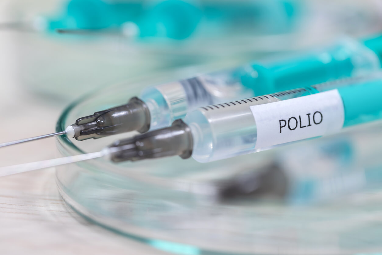 An image of a syringe labelled "polio."