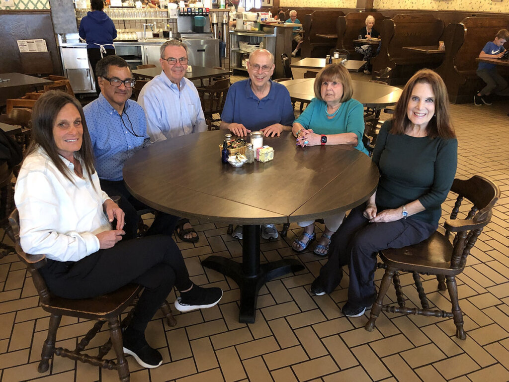 Susan Birkenstein Ori, Robin Washington, Gary Eide, Marc Slutsky, Sonia Geffen and Sally Birkenstein Eide at the Country Kitchen in Highland Park, a suburb of Chicago.