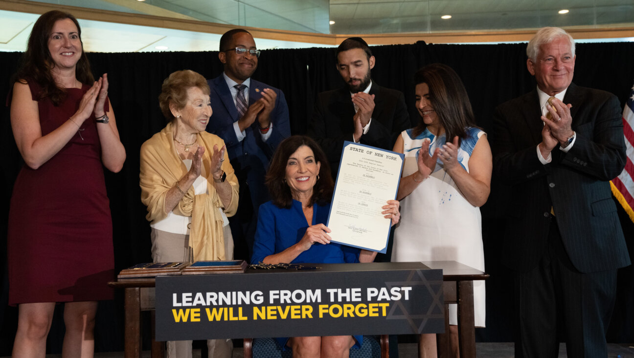 Gov. Kathy Hochul signs a legislative package to support Holocaust survivors in educational, cultural and financial institutions on Aug. 10, 2022.