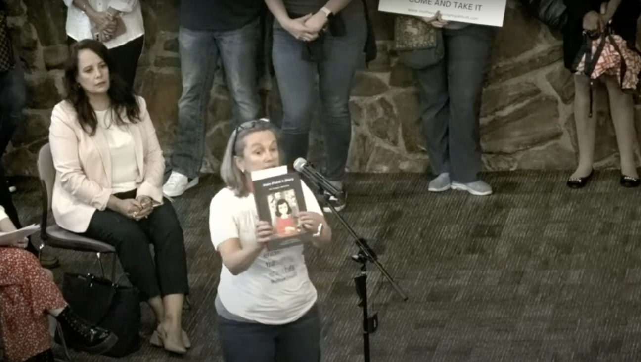 Gretchen Valing reads aloud from “Anne Frank’s Diary: The Graphic Adaptation” at a board meeting for the Keller Independent School District in Keller, Texas, Aug. 22, 2022. The district had ordered the removal of the book from its schools the week prior. (Screenshot)