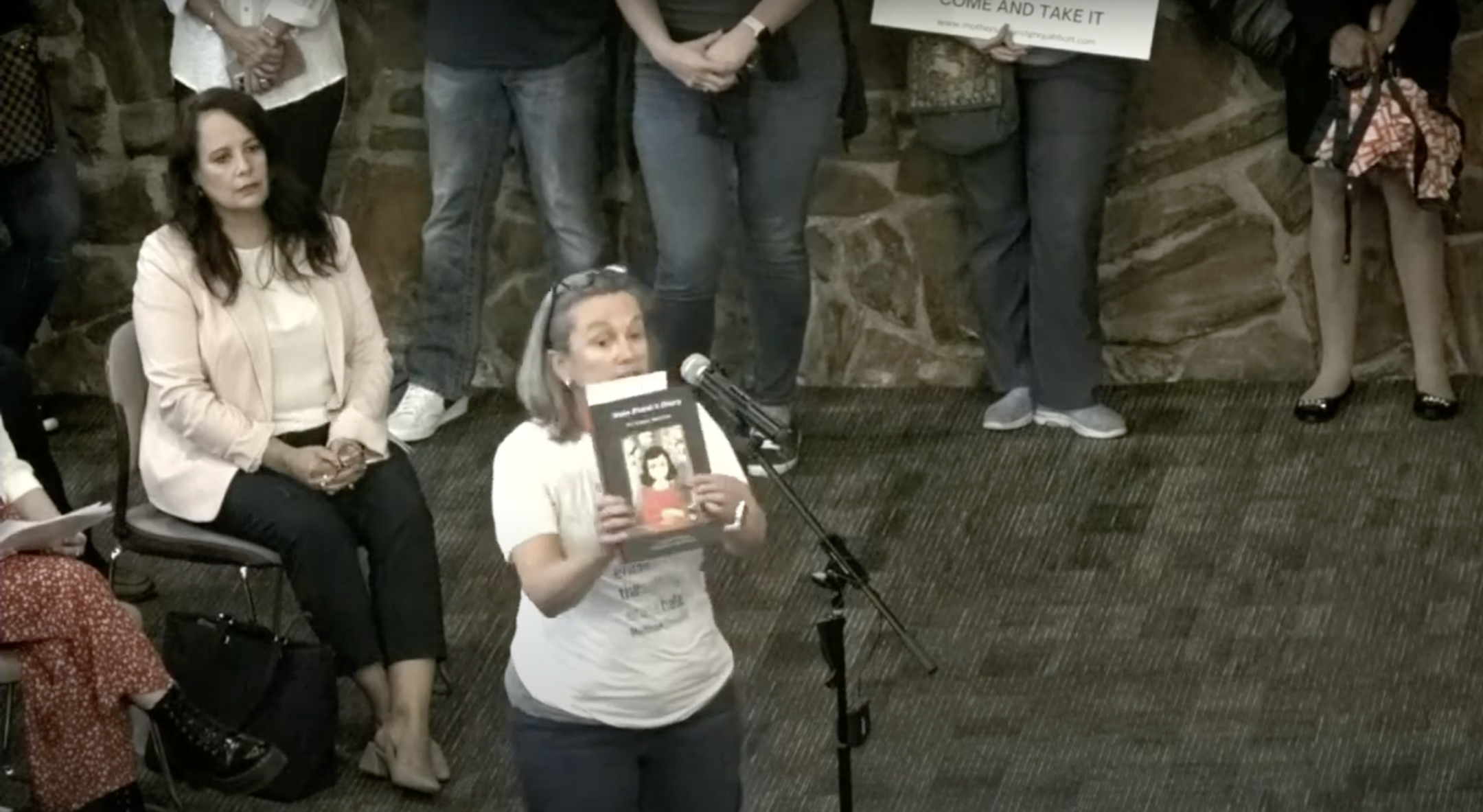 Gretchen Valing reads aloud from “Anne Frank’s Diary: The Graphic Adaptation” at a board meeting for the Keller Independent School District in Keller, Texas, Aug. 22, 2022. The district had ordered the removal of the book from its schools the week prior. (Screenshot)