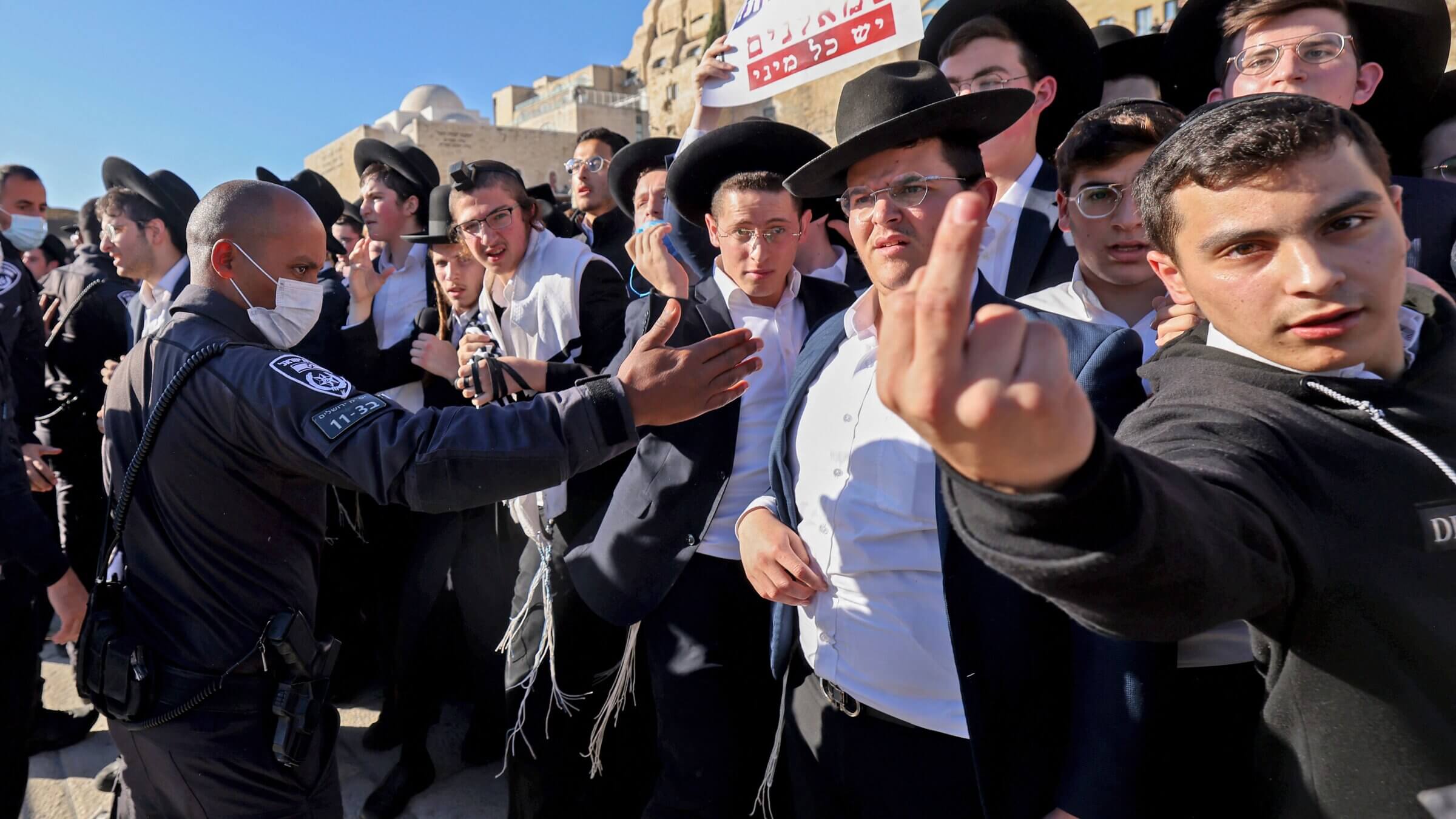 Orthodox Jews clash with Israeli security forces during a protest against "Women of the Wall," a group of women activists that advocates for pluralistic prayer, at the Western Wall in Jerusalem on Nov. 5, 2021. Women of the Wall were met with violence at the Western Wall as they tried to enter the plaza holding Torah scrolls in a long-running campaign for gender equality at the site.