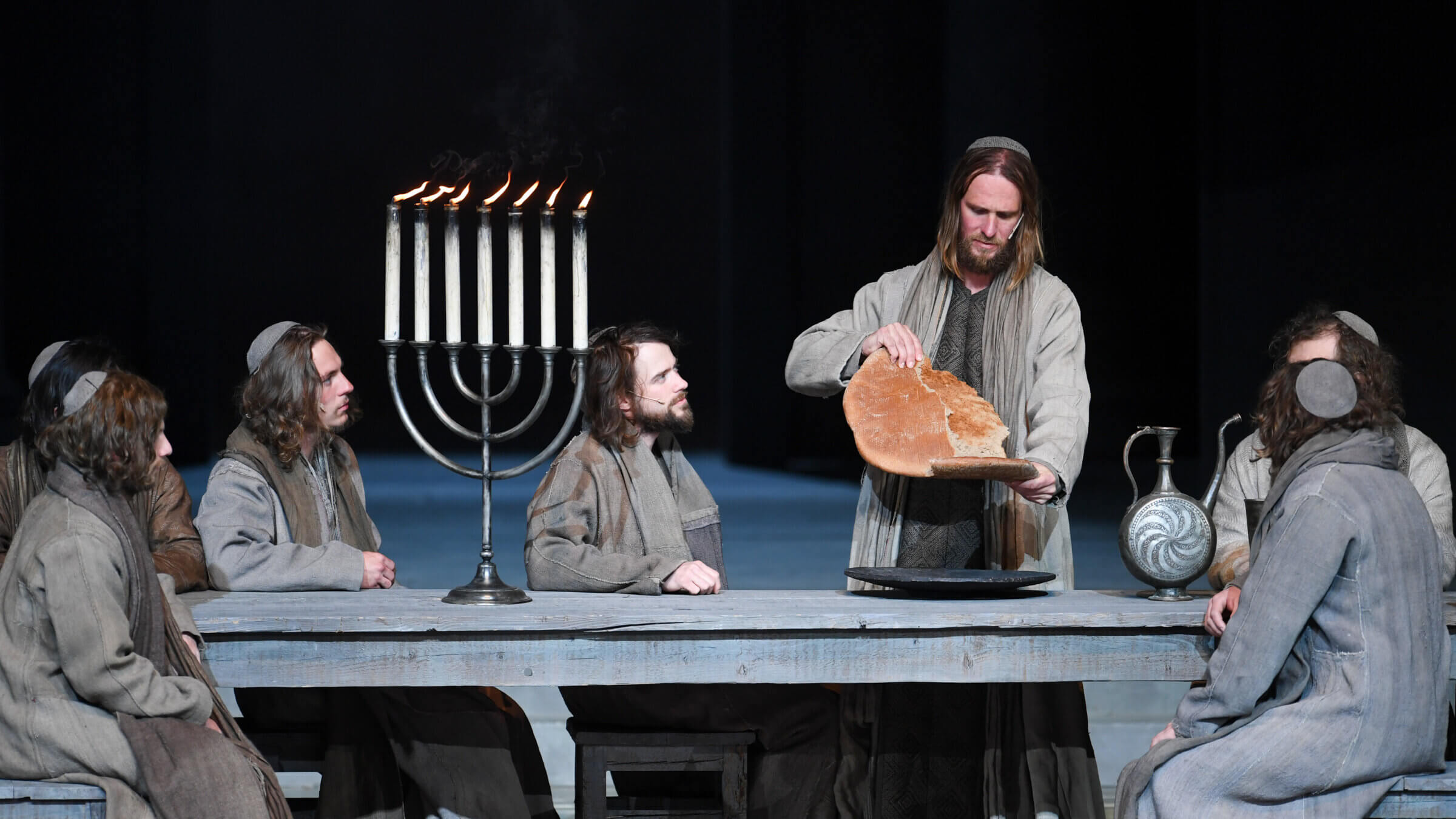 Jesus shares bread with his disciples during the Last Supper at the dress rehearsal for the Oberammergau Passion Play.