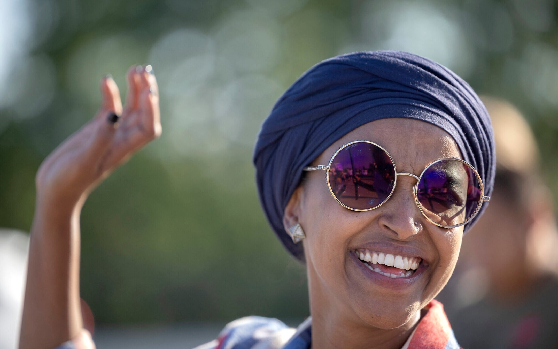 U.S. Rep. Ilhan Omar waves during a voter engagement event in Minneapolis, Aug. 9, 2022. (Star Tribune via Getty Images)