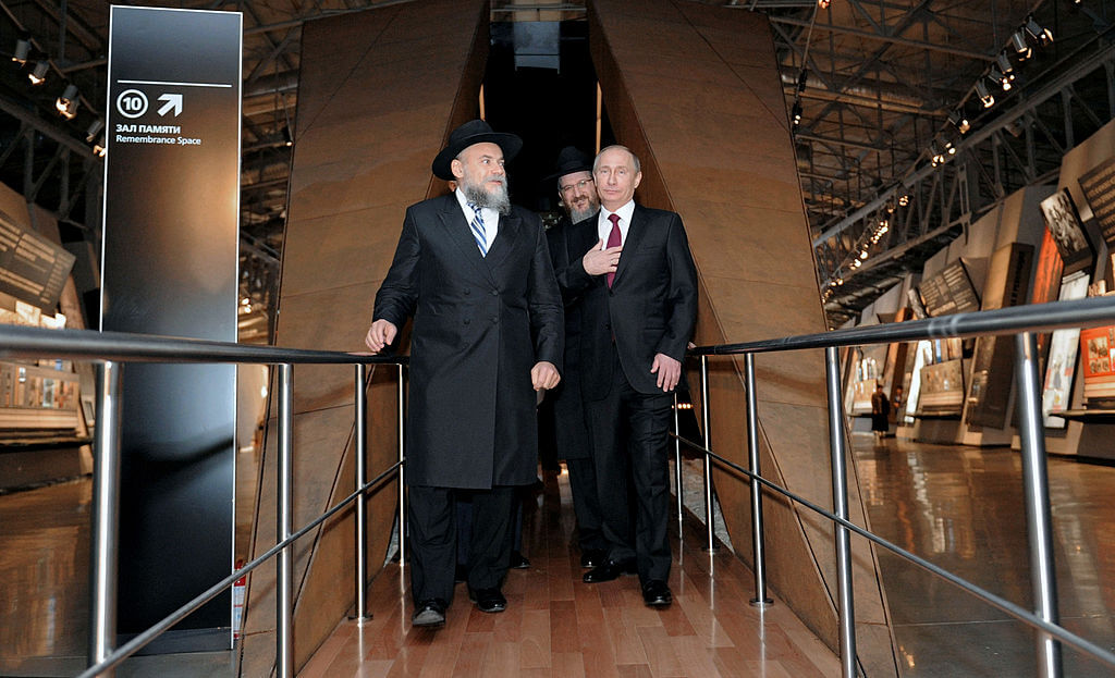 Russia's President Vladimir Putin, right, with Rabbi Alexander Boroda, left, and Rabbi Berel Lazar, center, in a visit to the Jewish Museum and Tolerance Center in Moscow in 2013.