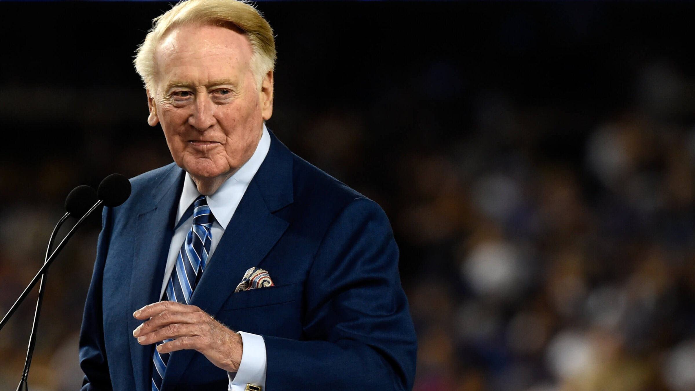 The late Vin Scully addressing the crowd during his retirement ceremony at Dodgers Stadium in 2016. 