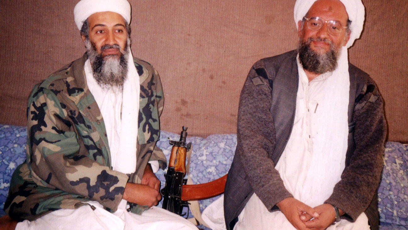 Ayman al-Zawahri, right, the Egyptian al-Qaida leader killed July 31, 2022 in a CIA missile strike, sits beside Osama bin Laden during a 2001 interview in Afghanistan.