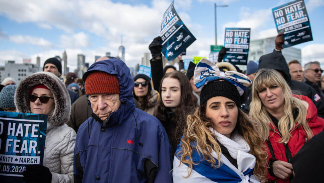 People participate in a Jewish solidarity march across the Brooklyn Bridge on January 5, 2020 in New York City. 