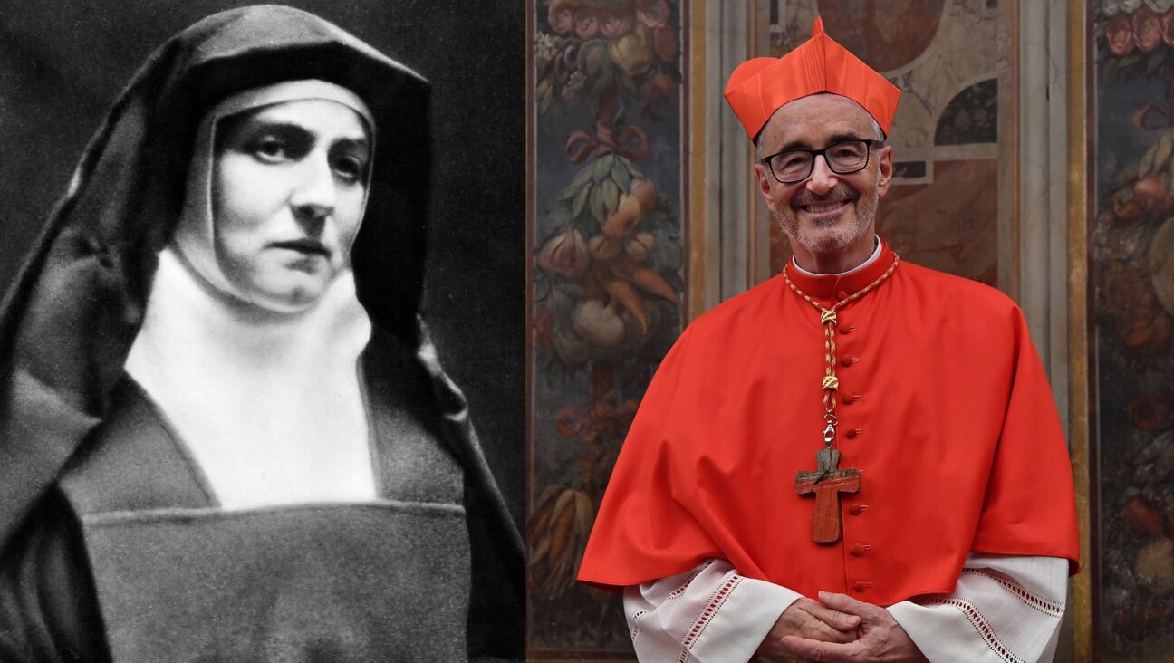 In his visit to Auschwitz Tuesday to commemorate the 80th anniversary of the murder of Saint Teresa Benedicta (born Edith Stein), Cardinal Michael Czerny spoke about his own family’s experience in the Holocaust. (Getty. Design by Mollie Suss)