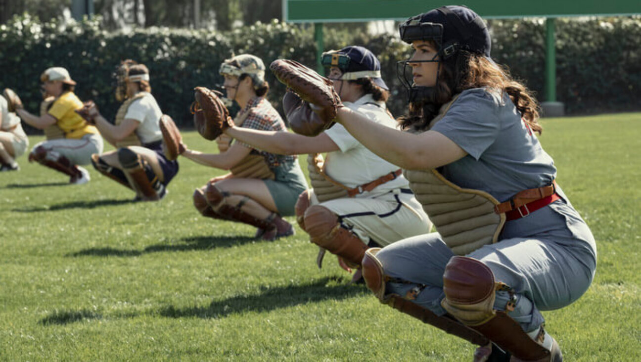 Abbi Jacobson (R) plays Carson, an awkward catcher from Idaho in the new series "A League of Their Own." 