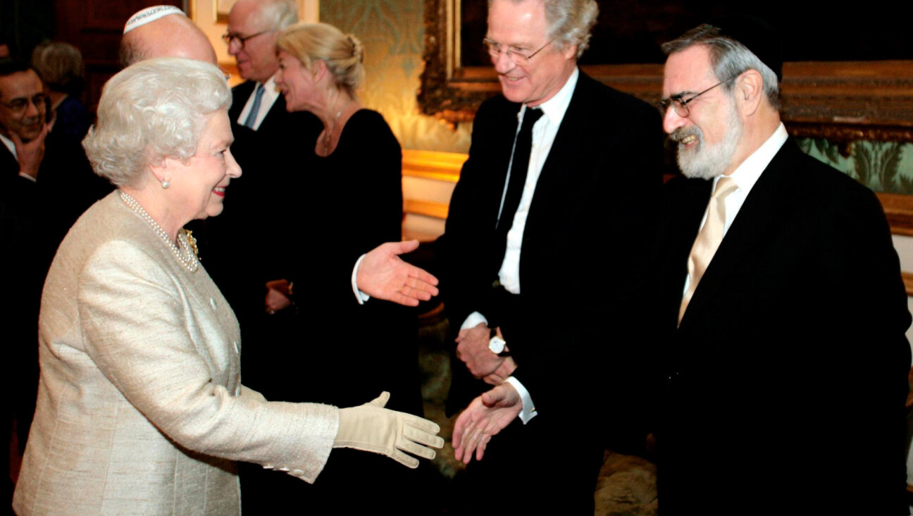Britain's Queen Elizabeth II meets Chief Rabbi Sir Jonathan Sacks as she attends a reception at St James's Palace in London to mark the 350th anniversary of the re-establishment of the Jewish community in Britain.