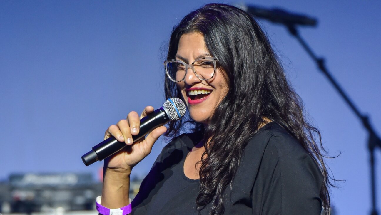 Michigan House Rep. Rashida Tlaib speaks on stage at a concert in Detroit, July 16, 2022. (Aaron J. Thornton/Getty Images)