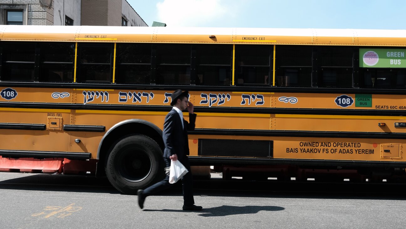 A yeshiva school bus drives through Borough Park, Brooklyn.