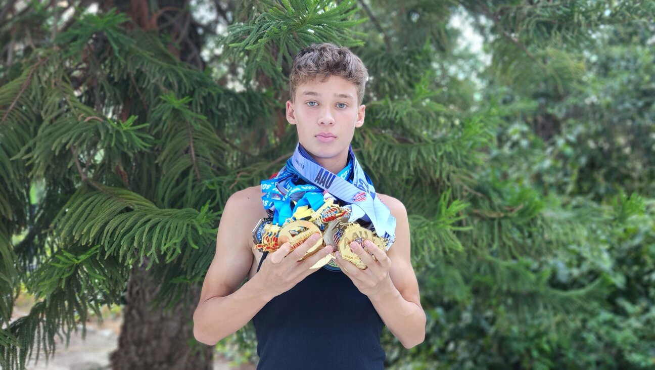 JJ Harel shows off his AAU medals. (Lucy Harel)