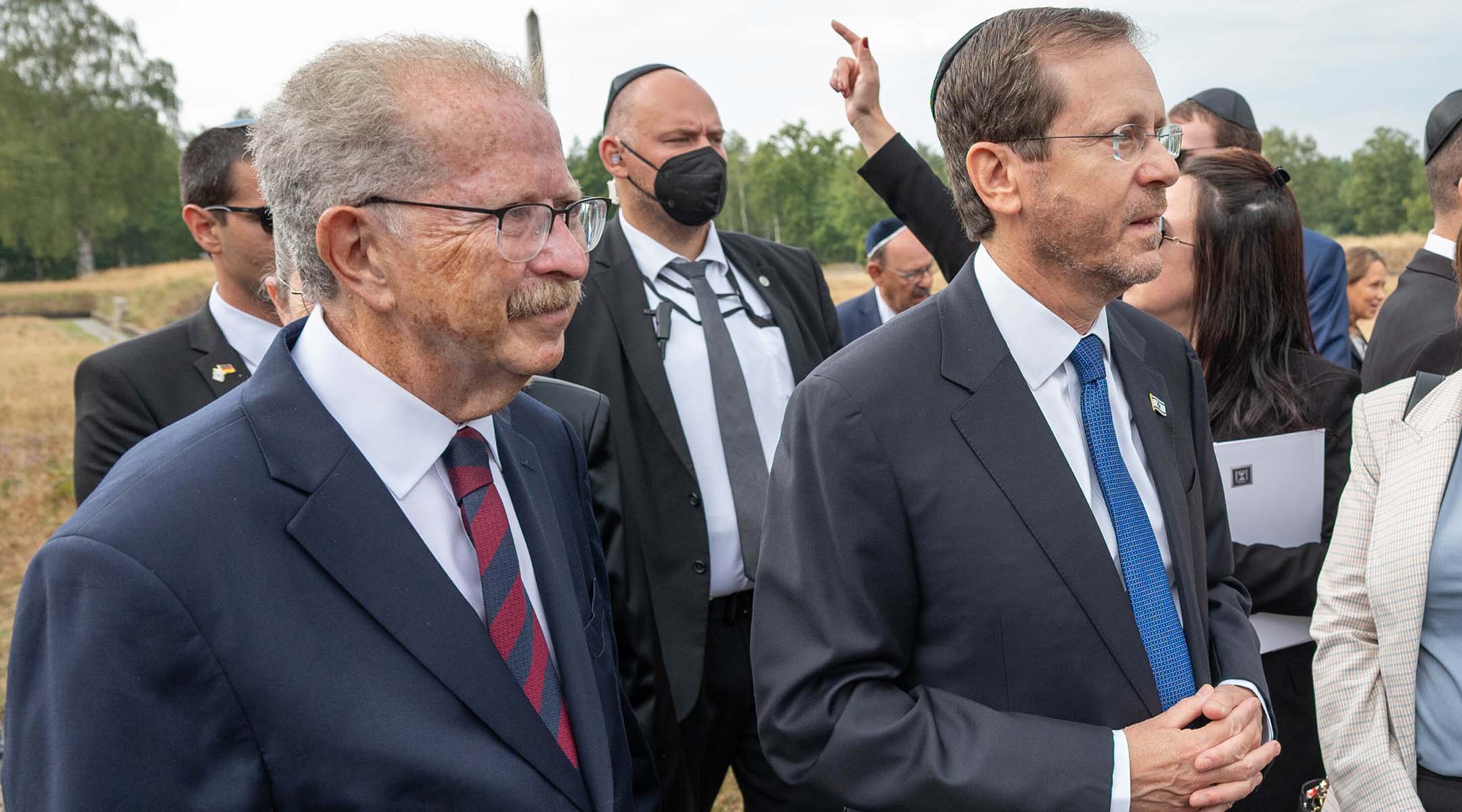 Menachem Rosensaft, left, accompanies Israeli President Isaac Herzog, right, on a visit to the Bergen Belsen concentration camp, Sept. 6, 2022. (Shahar Azran/WJC)