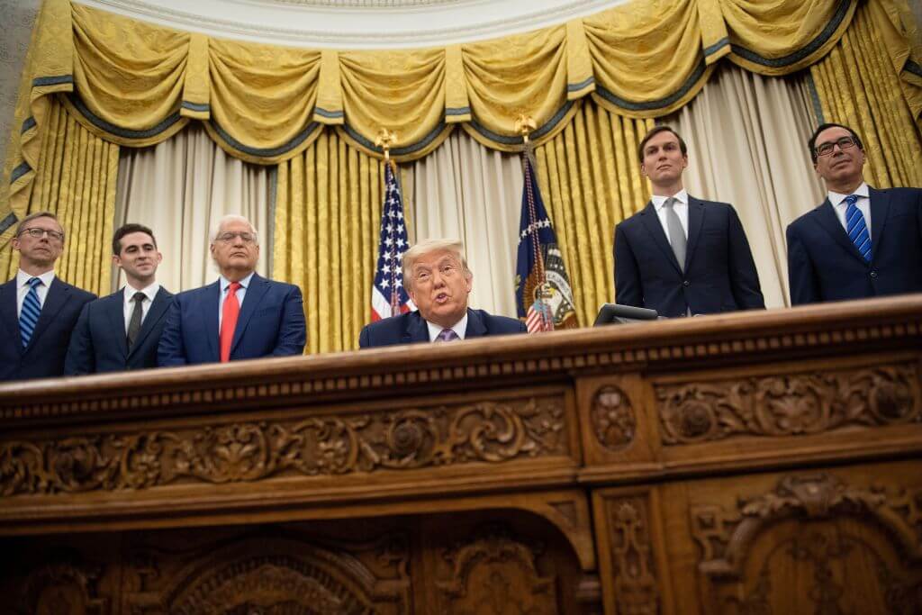David Friedman, then-U.S. ambassador to Israel, seated left of then-President Donald Trump, and to Trump's right, senior adviser Jared Kushner and U.S. Secretary of the Treasury Steven Mnuchin, listen while Trump announces an agreement between the United Arab Emirates and Israel on Aug. 13, 2020.