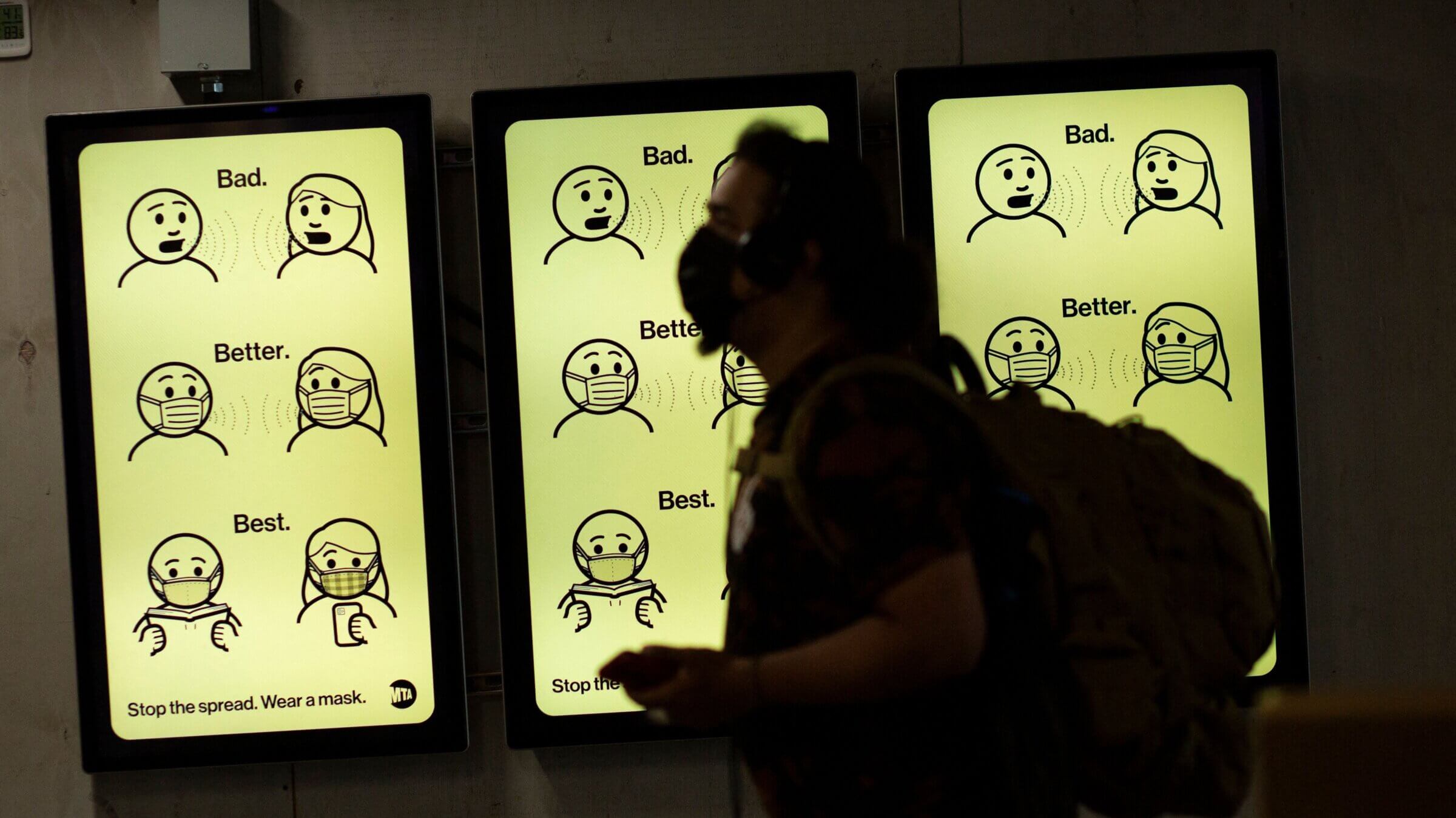 A sign in New York's Penn Station instructs passersby in proper mask etiquette.