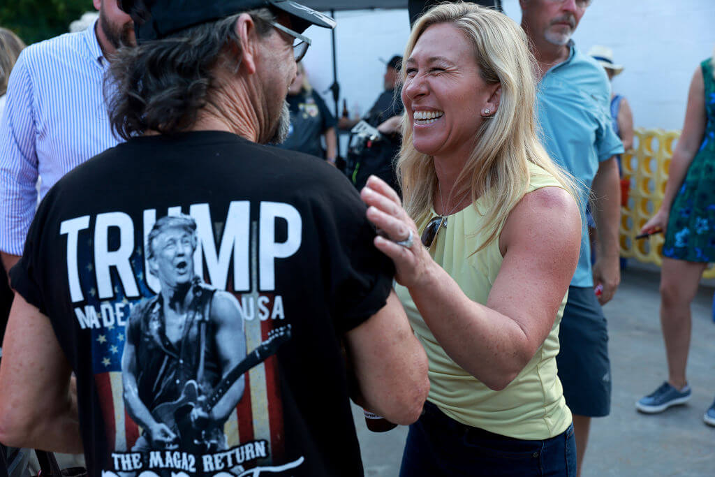 Rep. Marjorie Taylor Greene (R-GA) greets people as she campaigns during a Bikers for Trump event on May 20, 2022 in Plainville, Georgia.