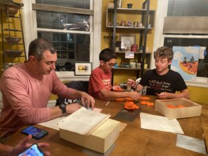 three men playing board game