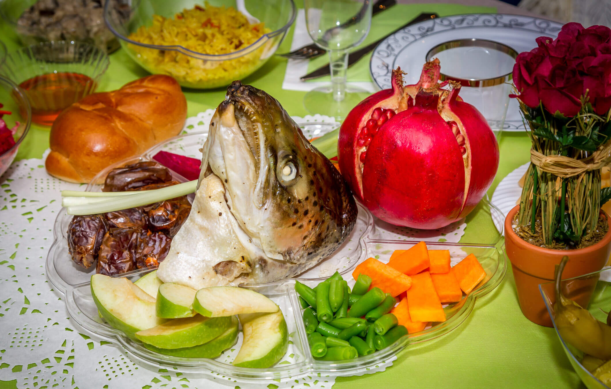 Doesn't the Rosh Hashanah seder look fun, fresh and appetizing? Just ignore the fish head glaring at you from the middle.