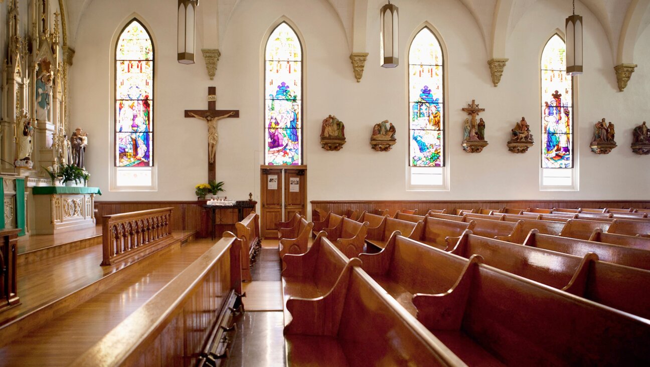 Light shines through the stained glass windows of a church. (Getty Images)