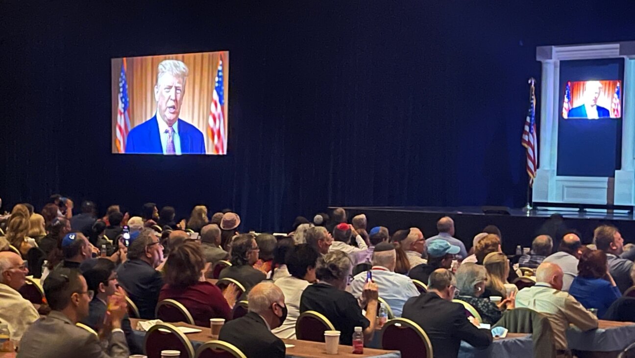 Republican Jewish Coalition members listen to a prerecorded video from Donald Trump, in the Venetian resort in Las Vegas, Nov. 6, 2021. (Ron Kampeas)