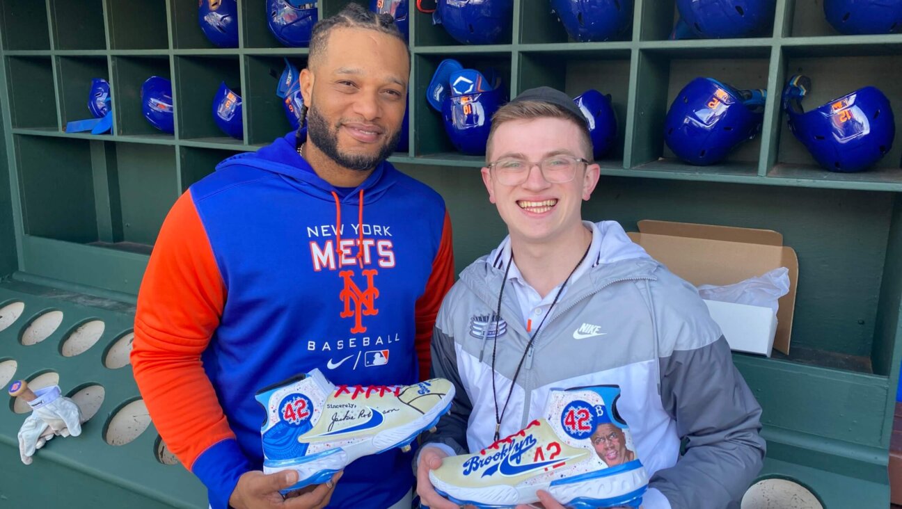 Ari Solomon, right, with Robinson Cano, second baseman for the Mets, in April.