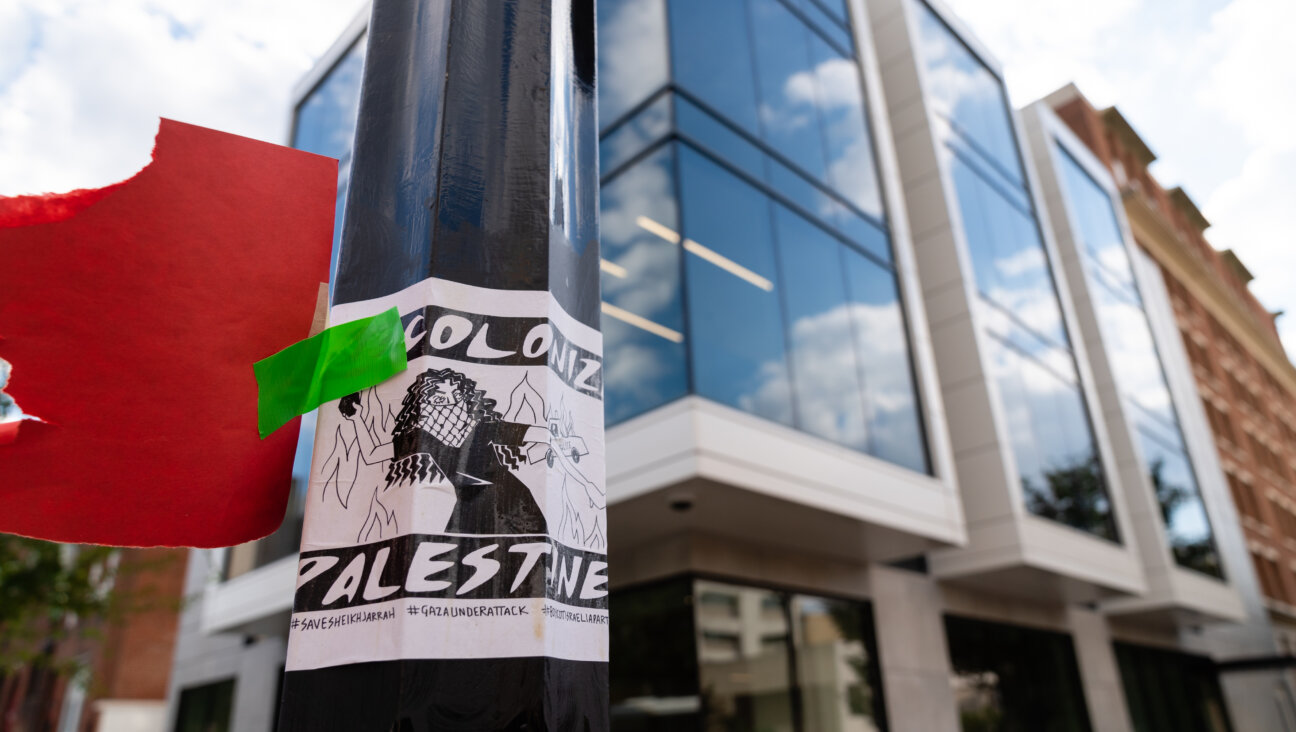A poster calling to "Decolonize Palestine" is pasted on a lamppost outside of the new Hillel building at George Washington University in October.
