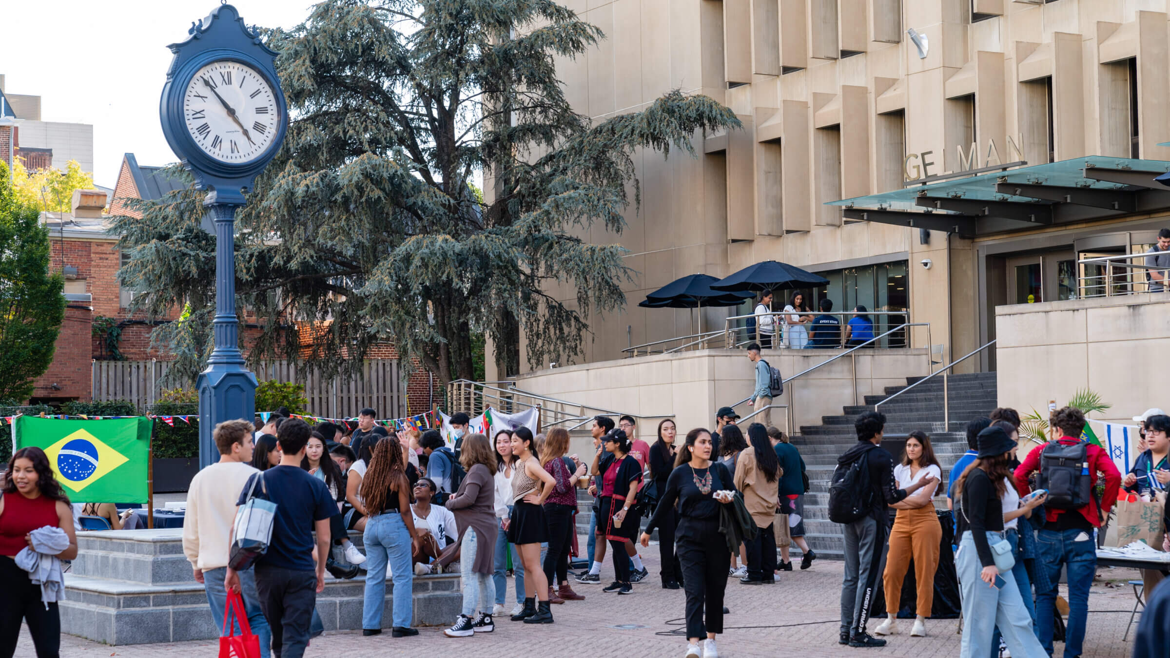 Students mingle during an event at Kogan Plaza, in the center of George Washington University's campus.