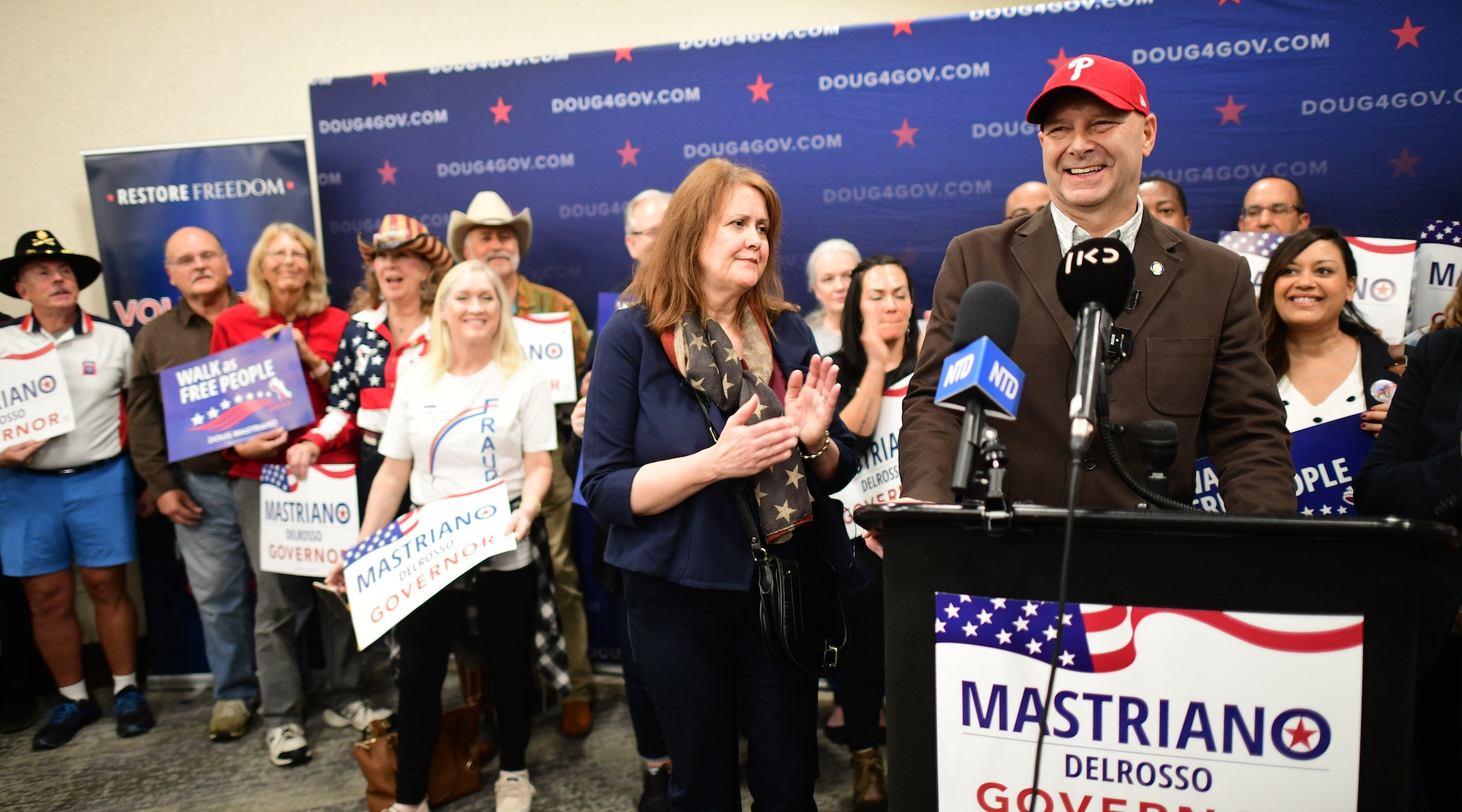 Doug Mastriano addresses the media as his wife Rebecca looks on during a rally in Manheim, Pa., Oct. 29, 2022. 
