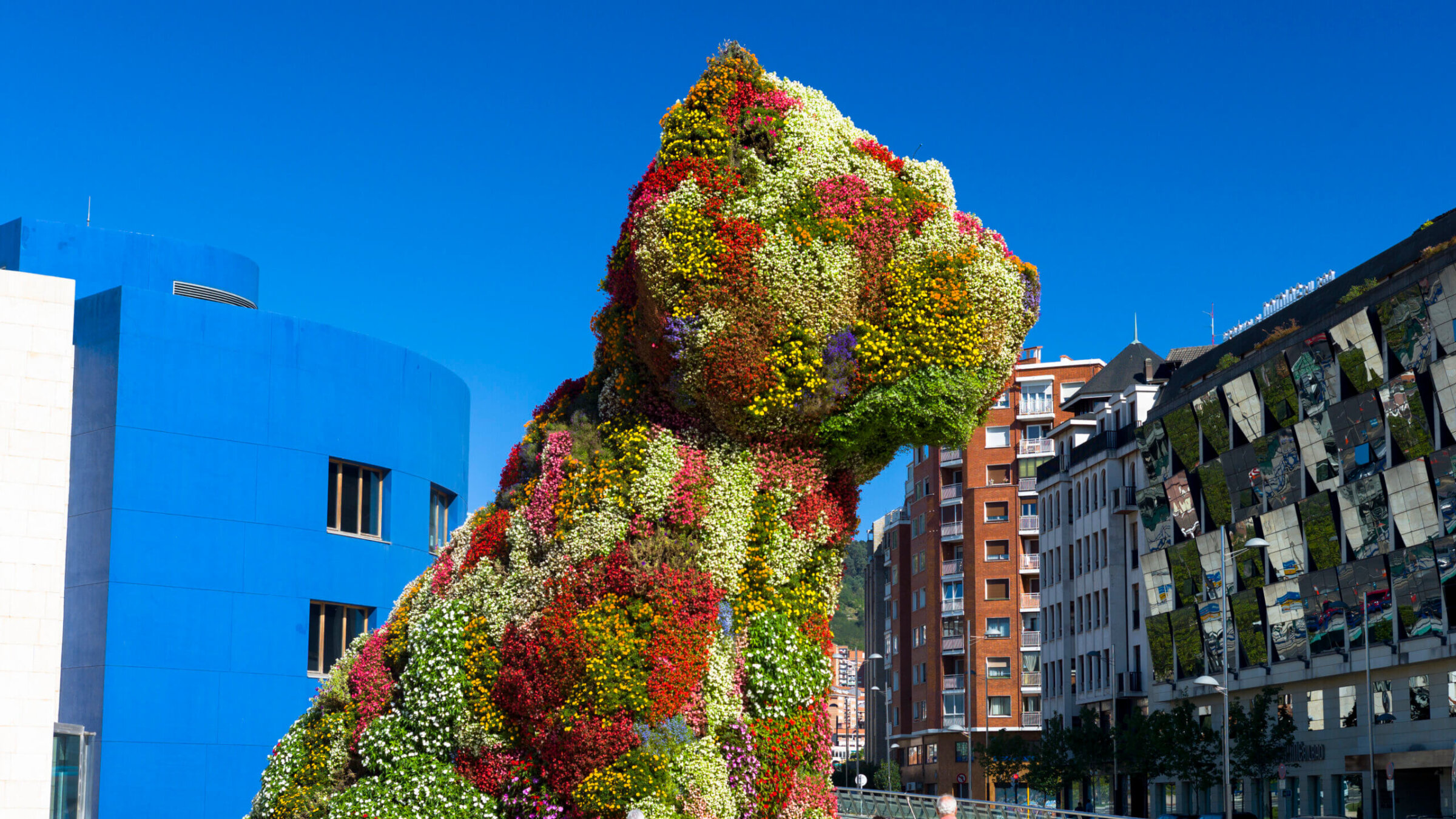 "Masterpiece," an installation of a puppy several dozen feet tall constructed with a skin of flowers