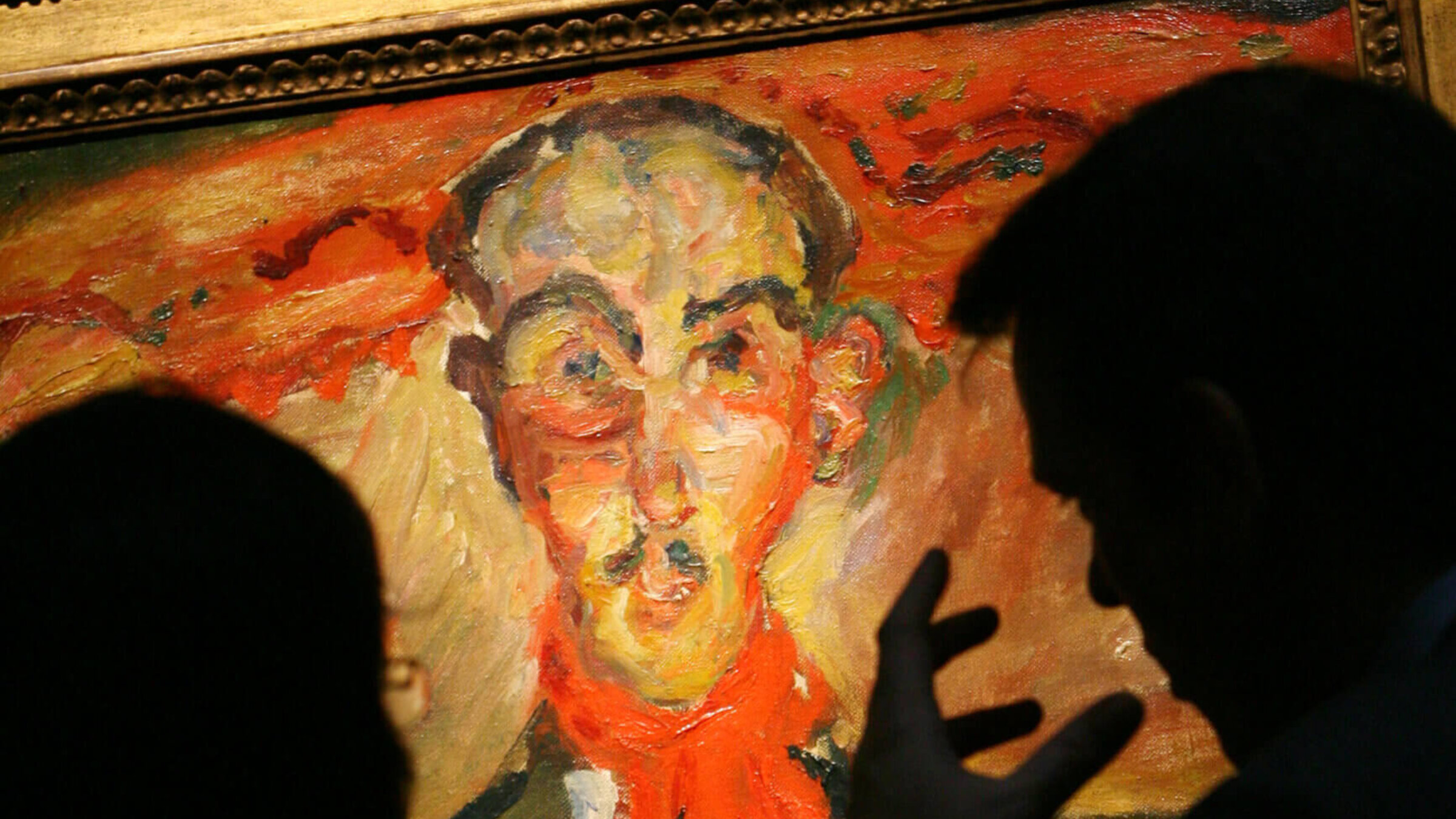  Visitors to the Sotheby's galleries look at a 1921 painting by Chaim Soutine entitled ''L'Homme au Foulard Rouge."