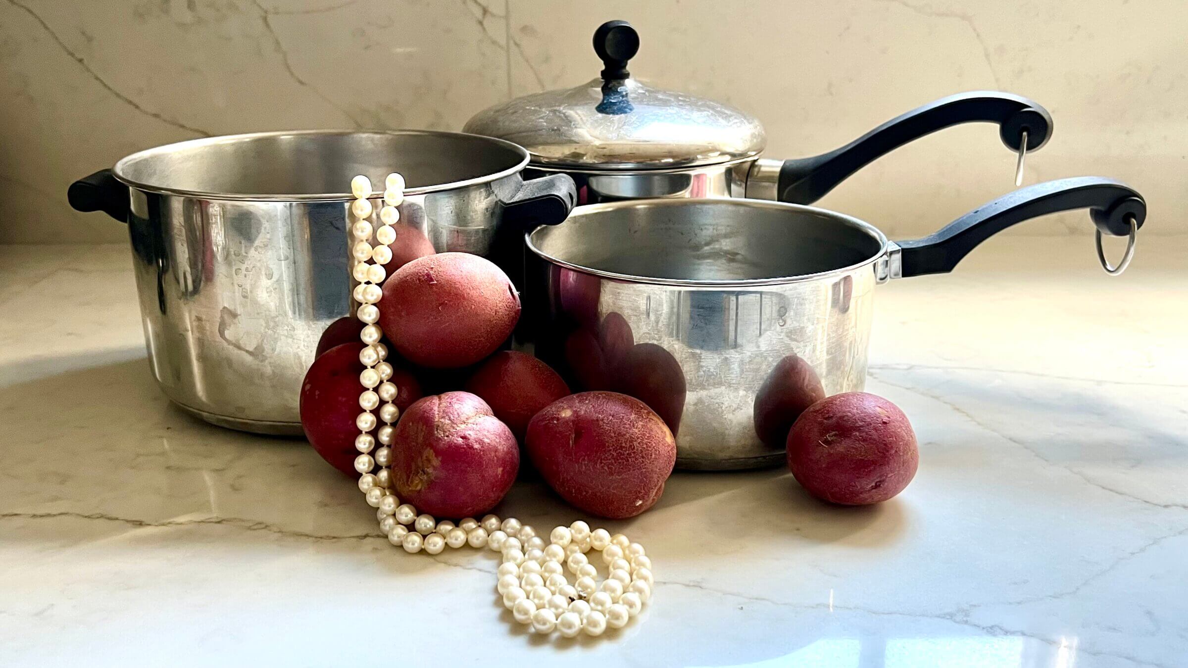 Farberware pots, potatoes and a strand of pearls serve as reminders of a loved one.