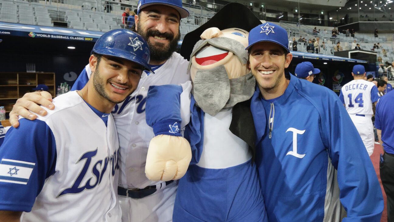 Team Israel players pose with the team mascot, The Mensch, after a victory in the World Baseball Classic in March 2017 in Seoul, South Korea.