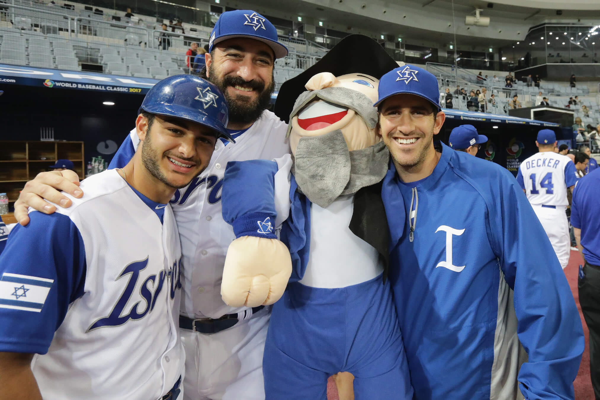 Team Israel players pose with the team mascot, The Mensch, after a victory in the World Baseball Classic in March 2017 in Seoul, South Korea.