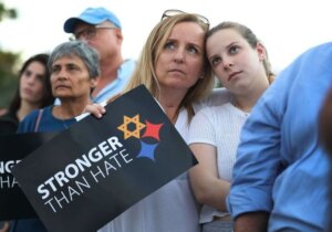 Iris Schaen and Jenny Schaen hug as they join with others for a solidarity vigil at the Holocaust Memorial Miami Beach to remember the victims of the mass shooting at the Tree of Life synagogue in Pittsburgh.