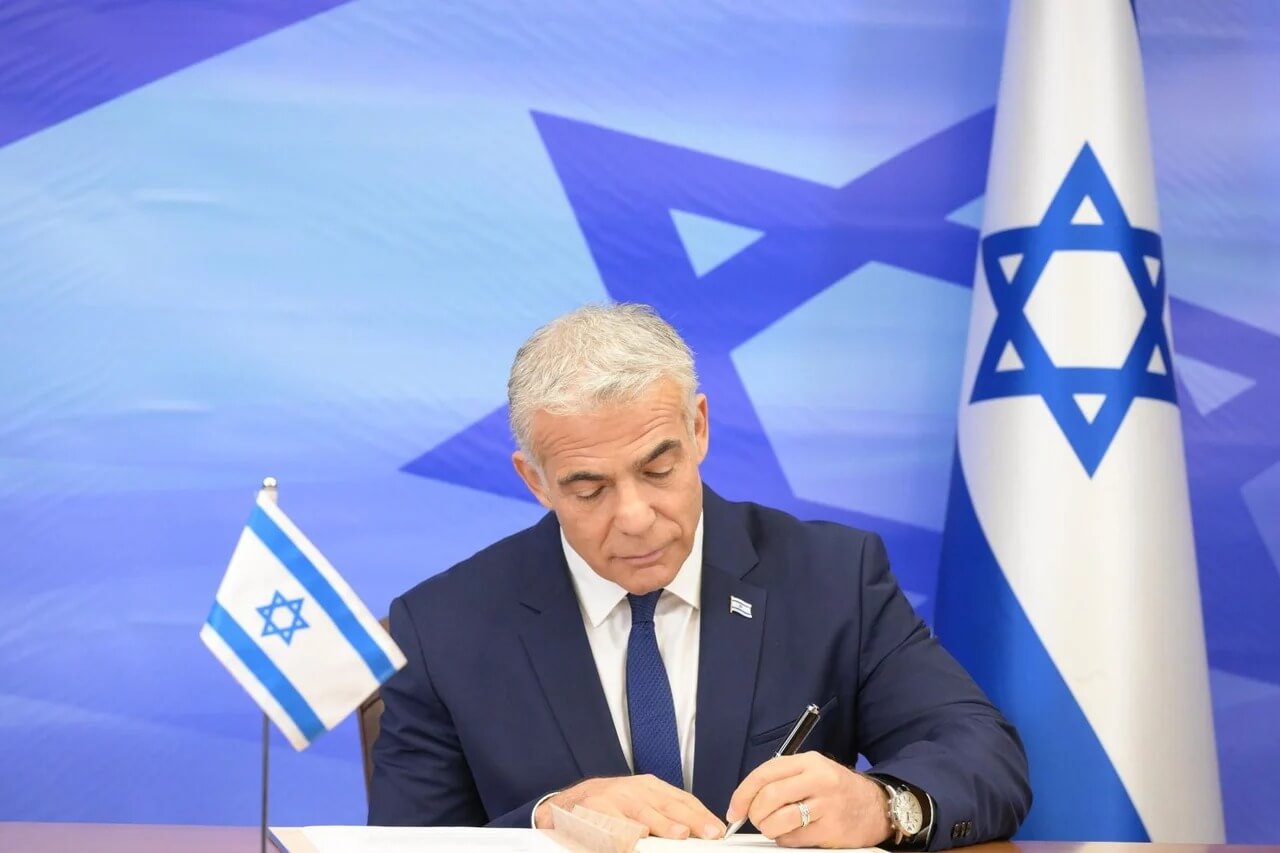 Israel's Prime Minister Yair Lapid signing the maritime deal with Lebanon.