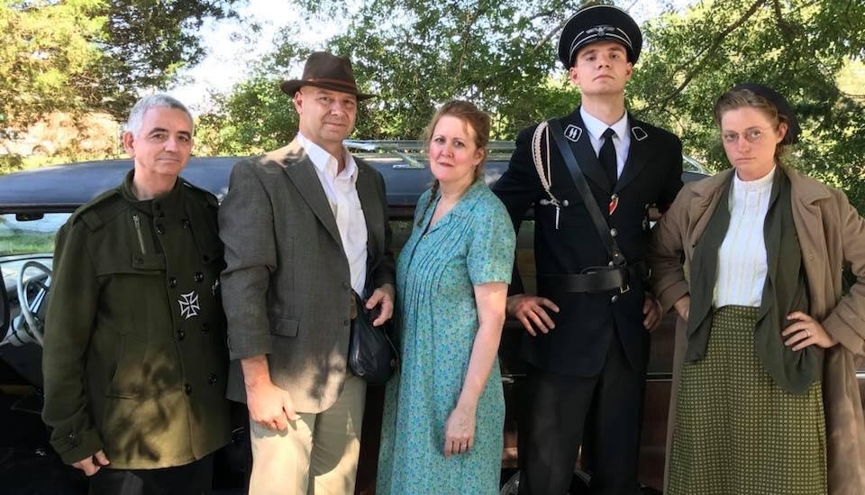 Doug Mastriano, second from left, poses on the set of a Holocaust era movie filmed in South Carolina, July 11, 2018. (Facebook)