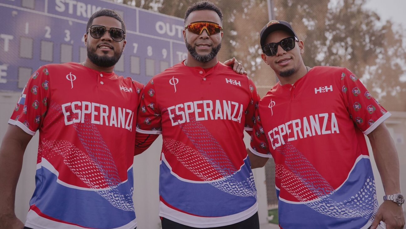 From left, Jeimer Candelario, Nelson Cruz and Cesar Hernandez pose for a photo at a baseball field in Raanana, Israel. (Nico Andre’ Duran)